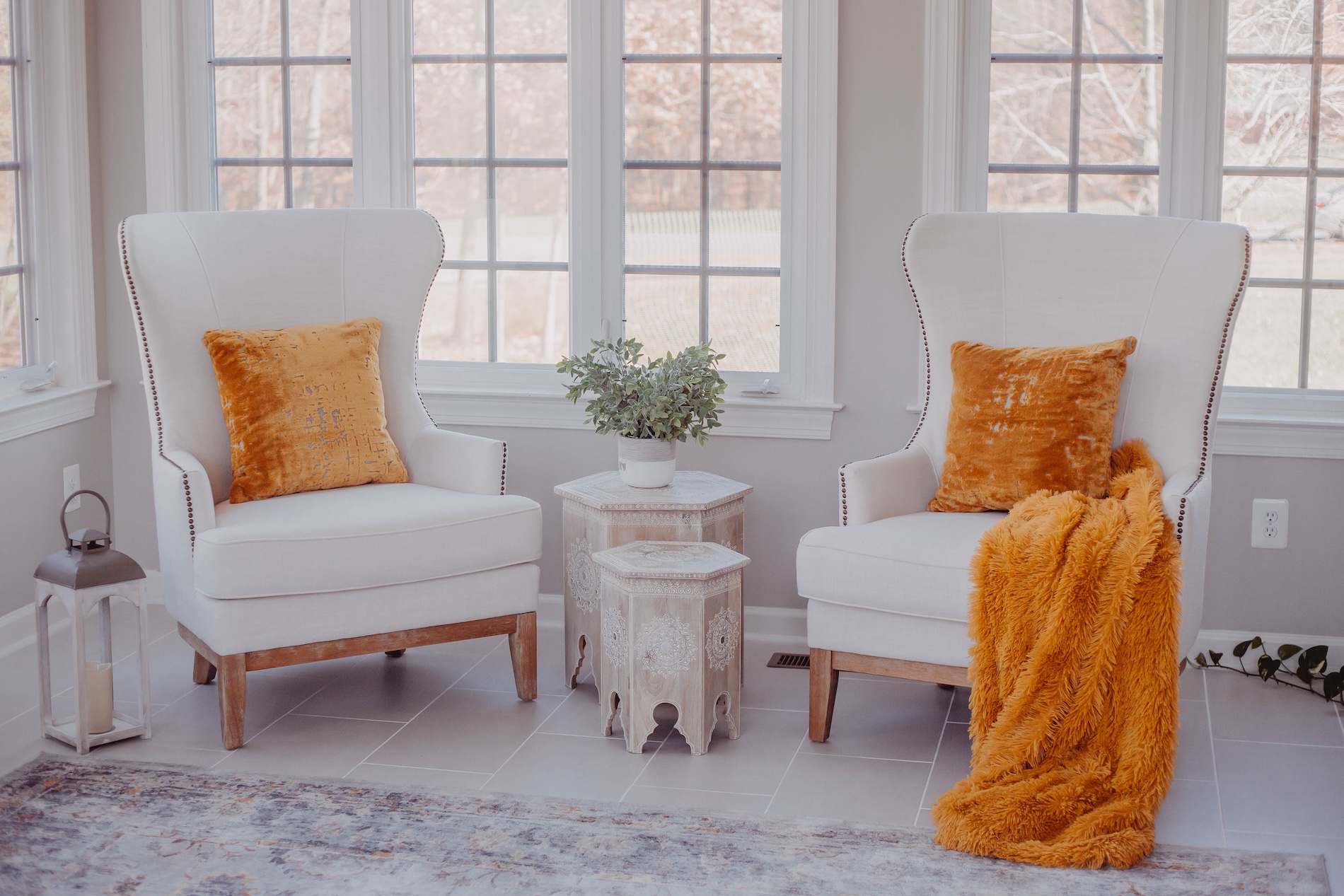 Accent Chairs With Orange Accent Pillows And Blanket