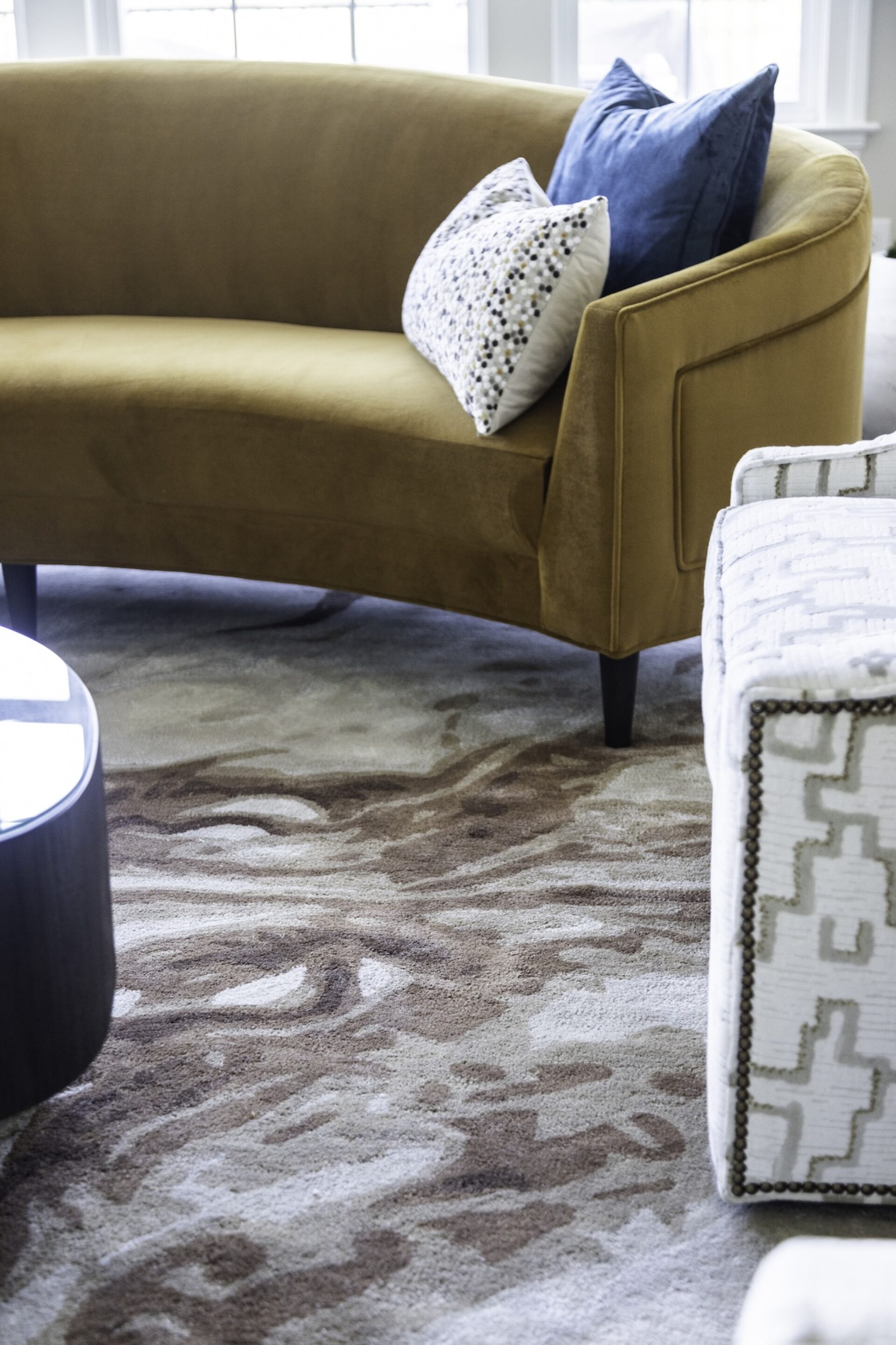 area rug mustard sofa and blue accent pillow