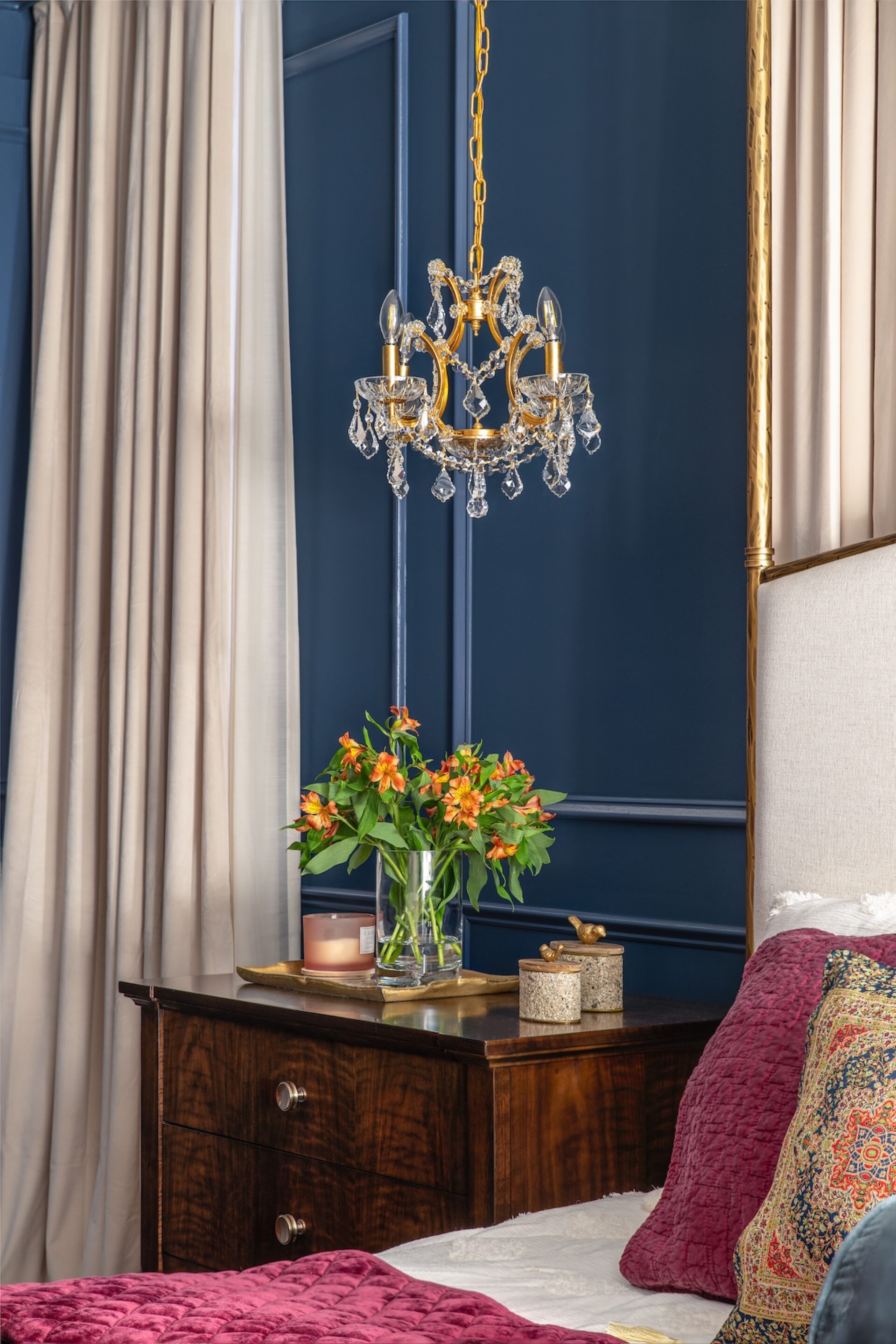 Bedroom Nightstand Detail With Small Chandelier