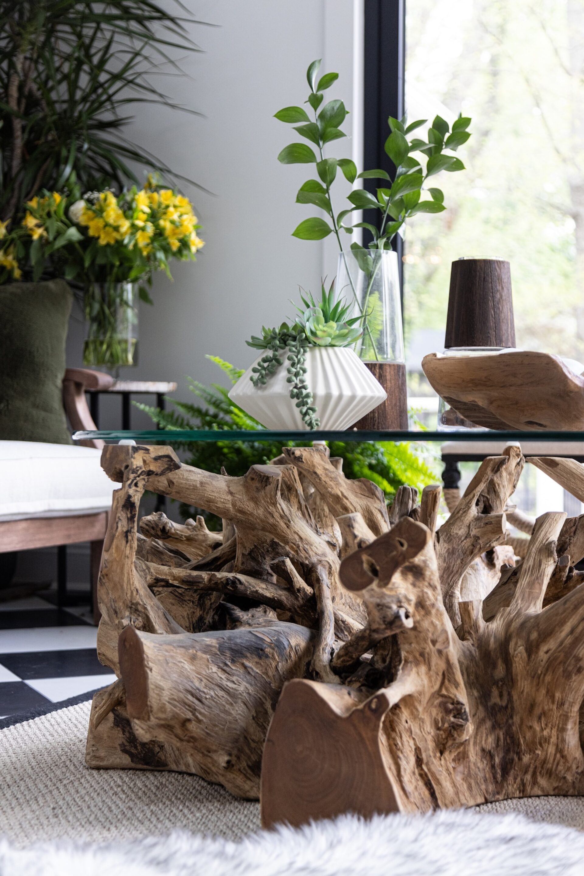 live wood base of coffee table with glass top
