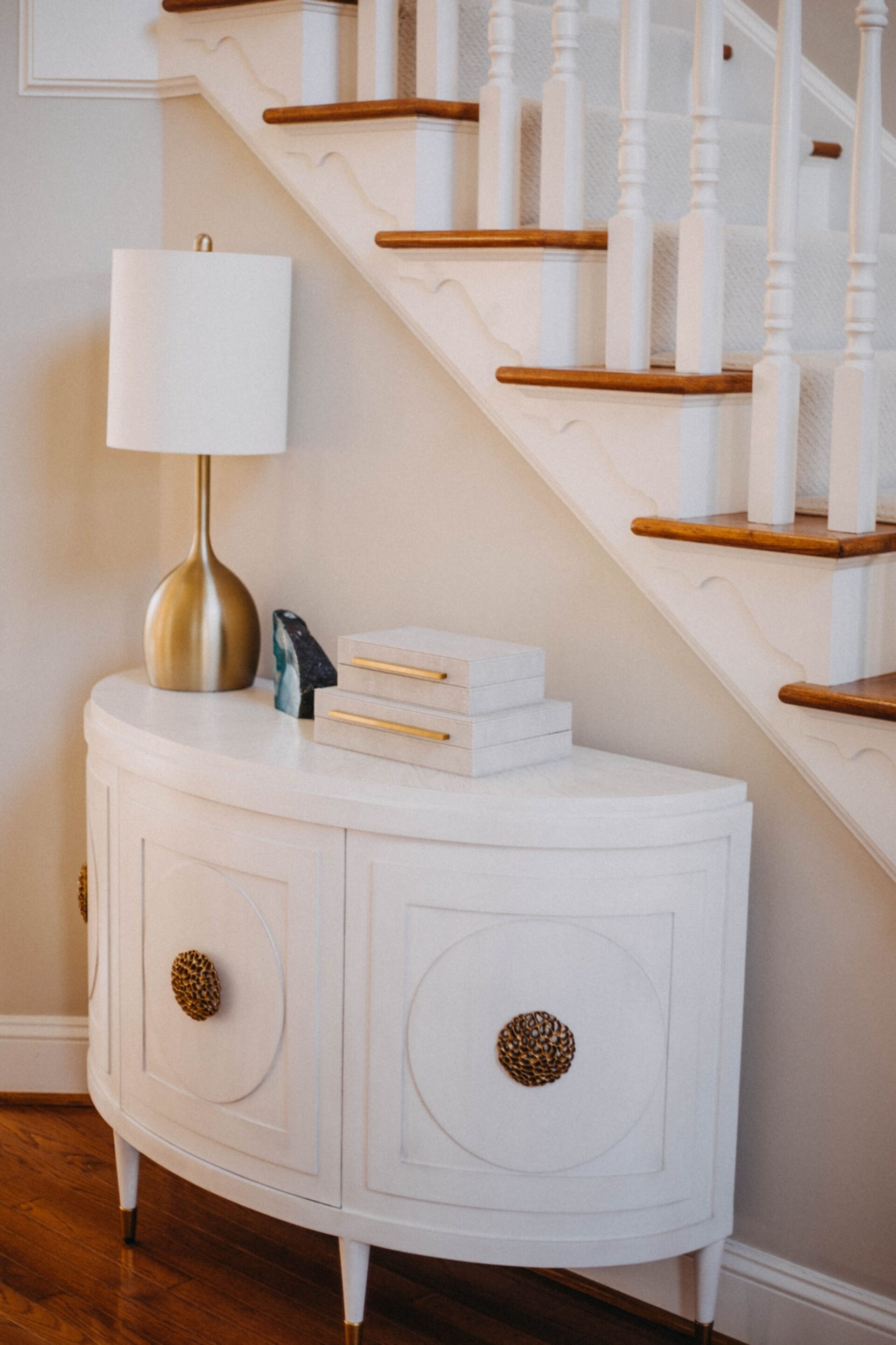Small Storage Table Near Staircase Entryway