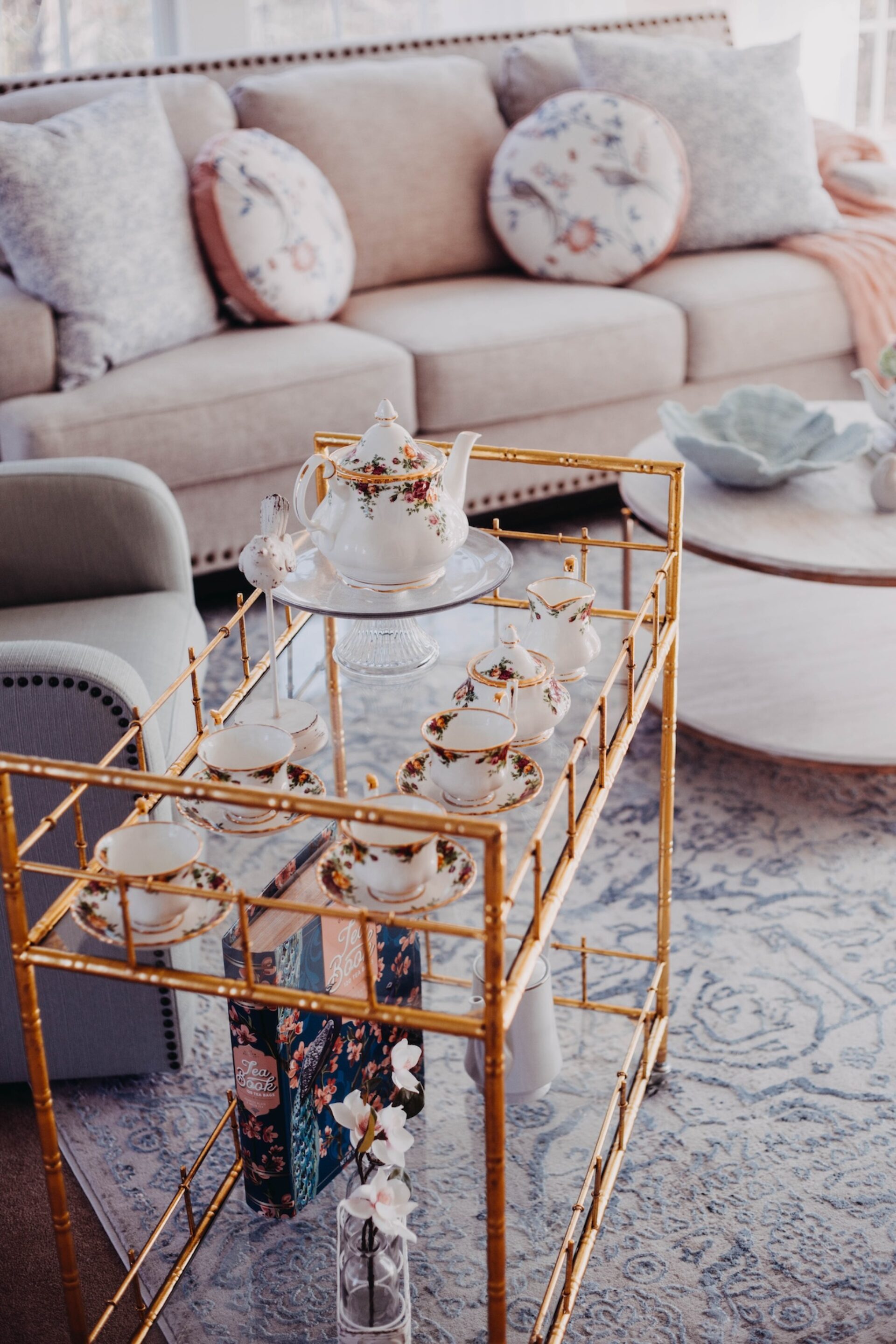 Tea Cups And Tea Pot On Glass Cart